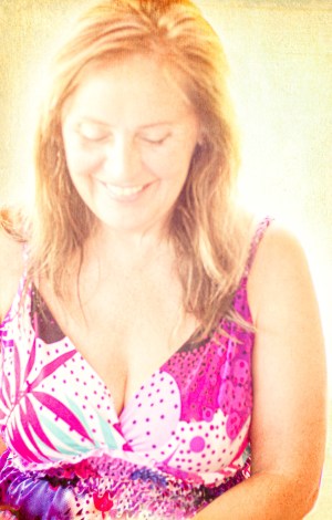 Woman wearing a colourful flowered dress illustrating undoing the belief in a beginning and end