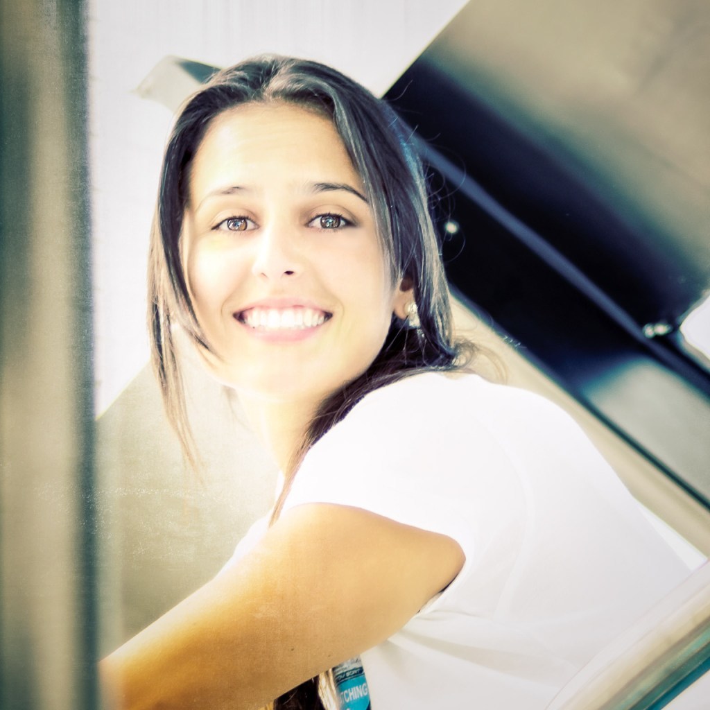 A woman with a big carefree smile representing the resolution of disturbing thoughts