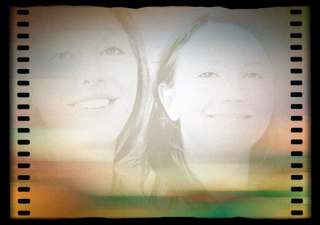 Two female students looking like close friends inside a stylised movie film strip frame