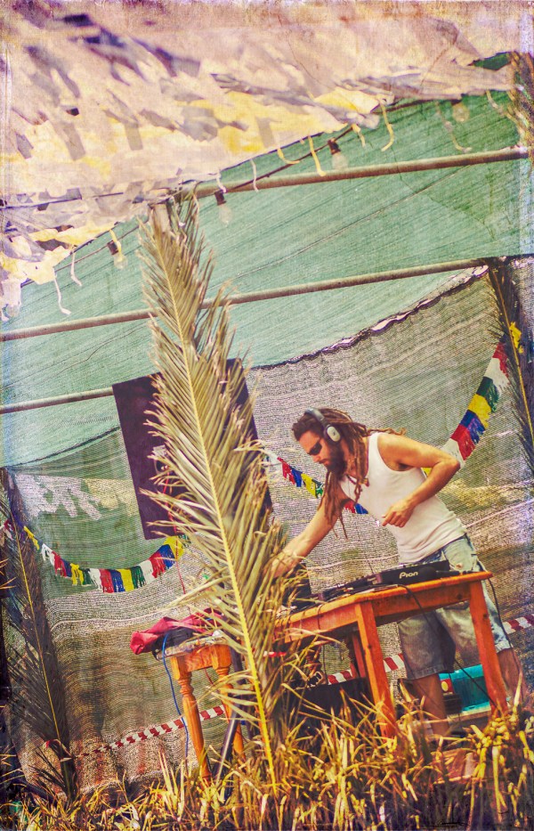 Rastafarian man DJing at a reggae event in a tropical outdoor setting representing cool facades