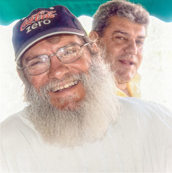 Two smiling grey-haired men representing a willingness to undo the deep belief in duality