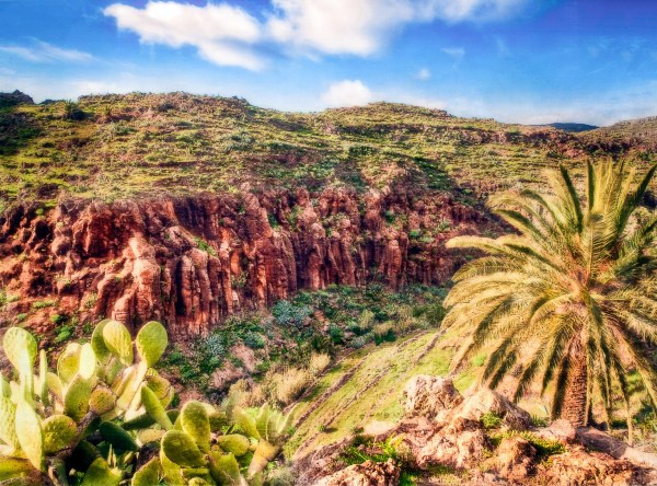 A deep steep mountain gorge that is visually difficult to categorise or label objectively