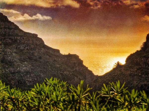 Sun setting over ocean valley representing Duality Hack 9: In the bliss of nothing with empty breath