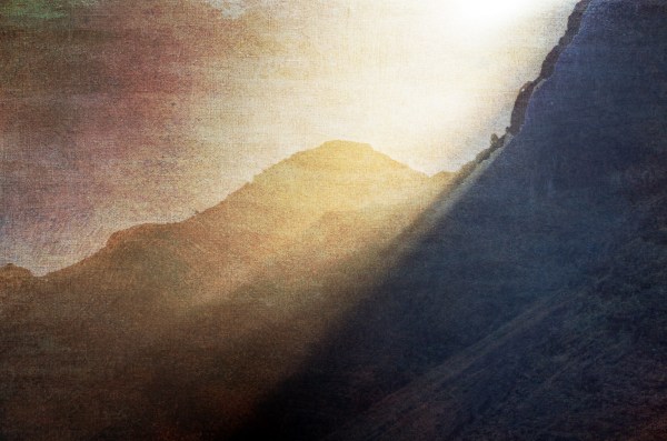 Sepia toned landscape picture of distant mountain ridges gradually fading into each other