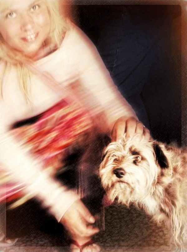 Although a bit nervous a woman enjoys petting a dog she just met illustrating a twofold response in a world of duality