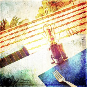 Painterly photo of a restaurant table place setting with cutlery illustrating limited form